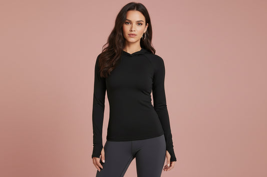 Woman wearing FlowEase Hooded Athletic Top in a relaxed fit