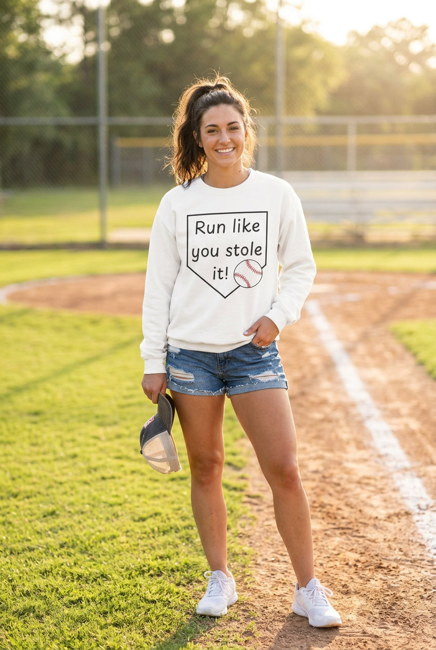 woman wearing a baseball graphic sweatshirt
