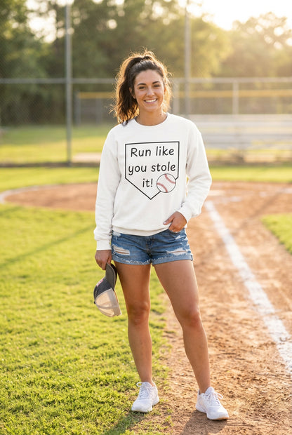 woman wearing a baseball graphic sweatshirt
